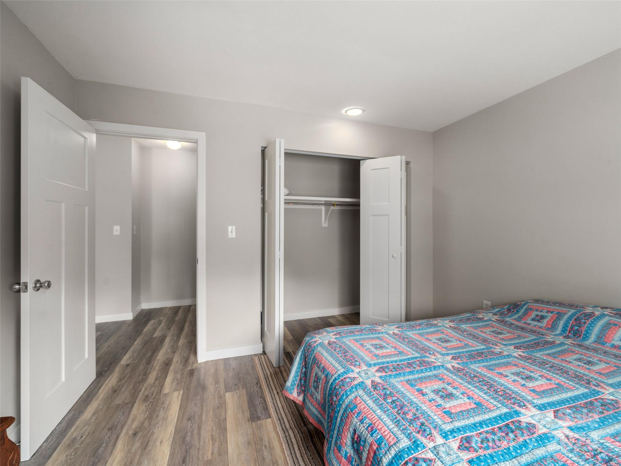 111 Shepard Square, Unit 608 Brevard, NC 28712 - Photo 12 of 29 a bedroom with a bed and a walk in closet