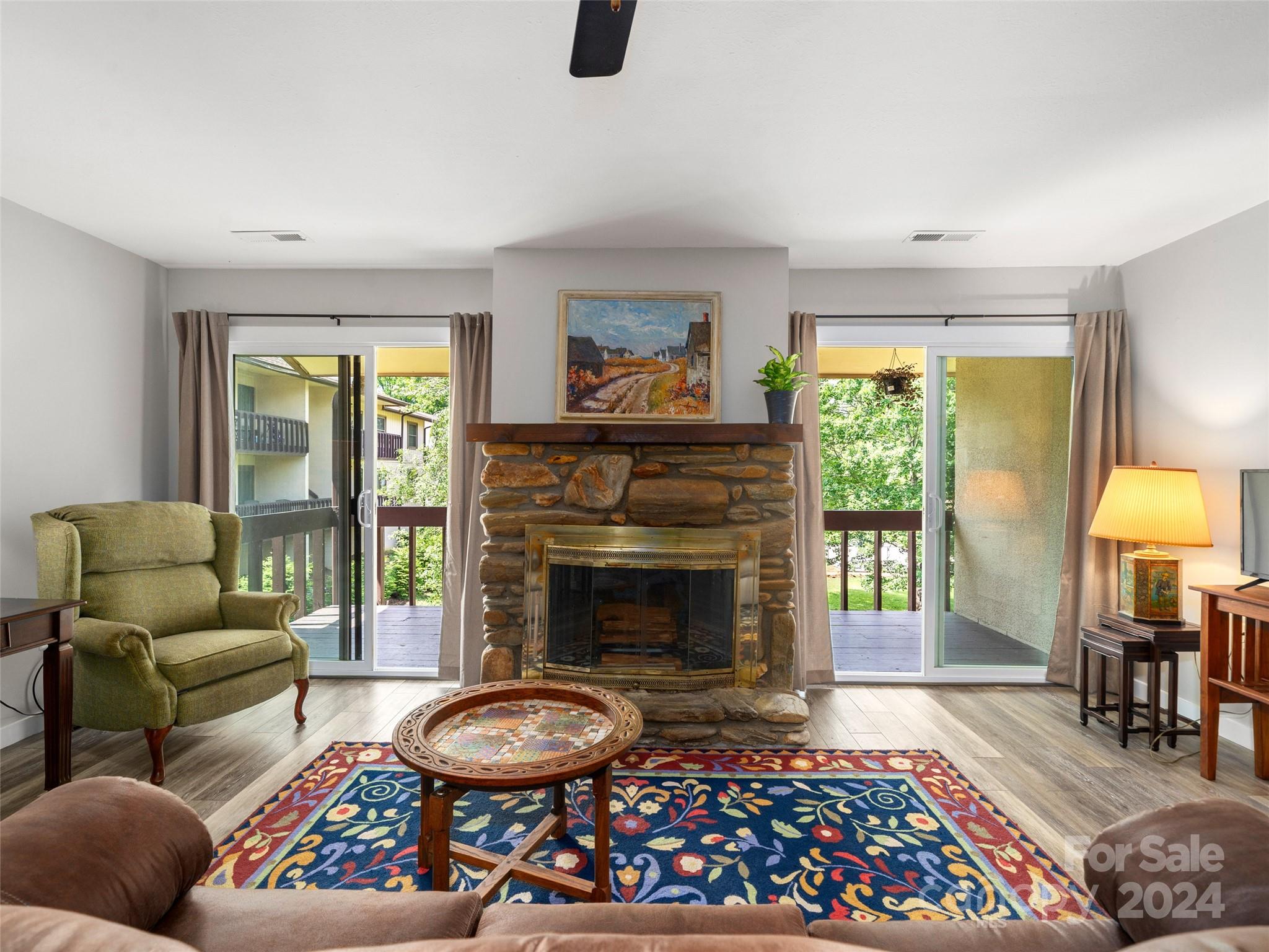 111 Shepard Square, Unit 608 Brevard, NC 28712 - Photo 2 of 29 a living room with furniture and a fireplace