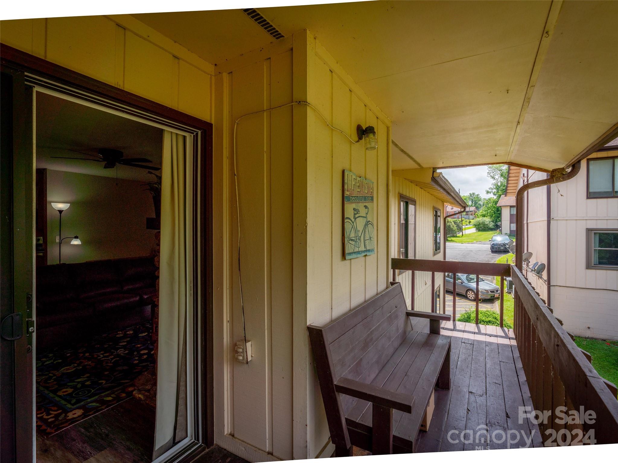111 Shepard Square, Unit 608 Brevard, NC 28712 - Photo 24 of 29 a view of a house with a porch and furniture
