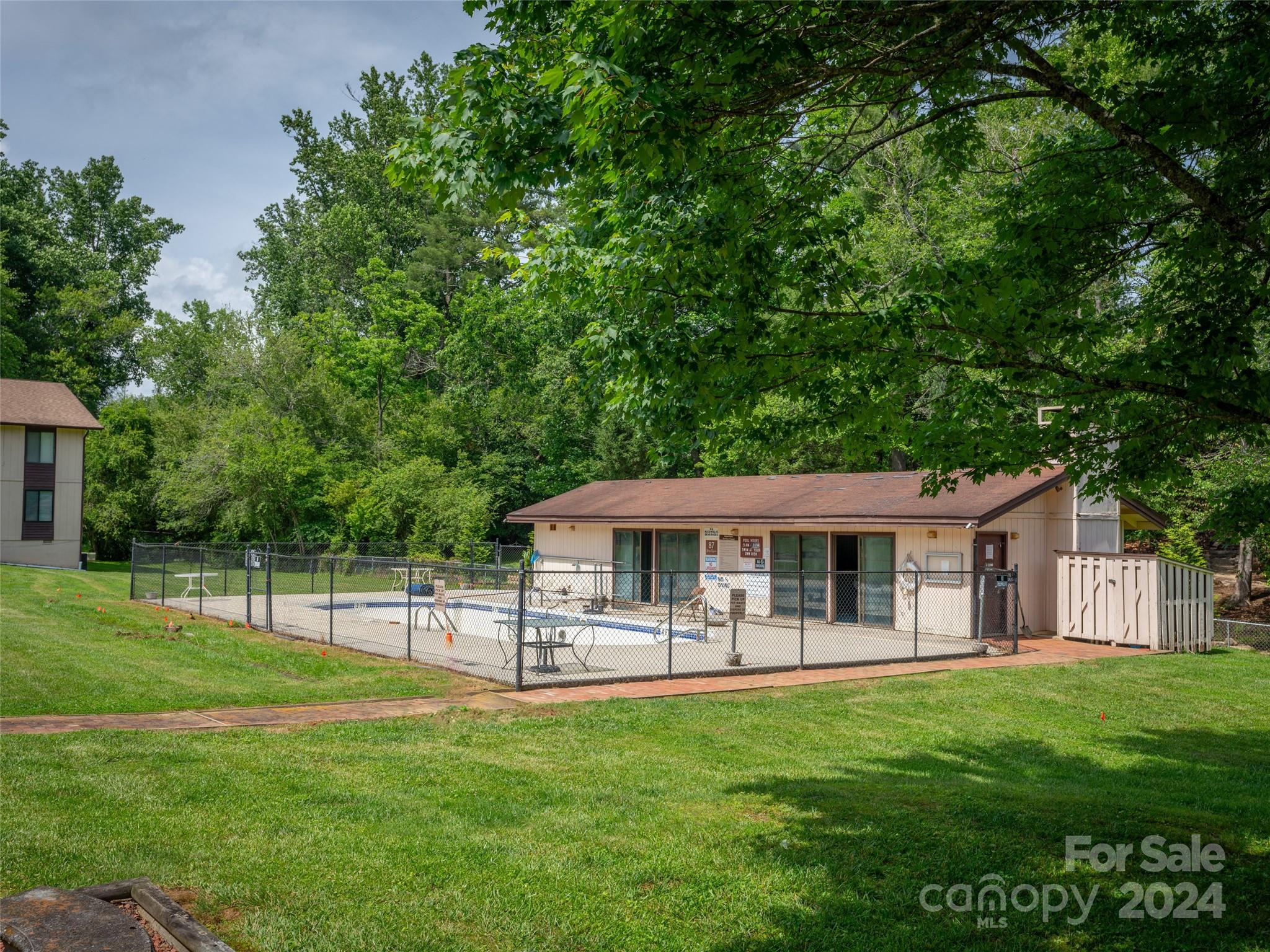 111 Shepard Square, Unit 608 Brevard, NC 28712 - Photo 25 of 29 a view of a house with a backyard porch and sitting area