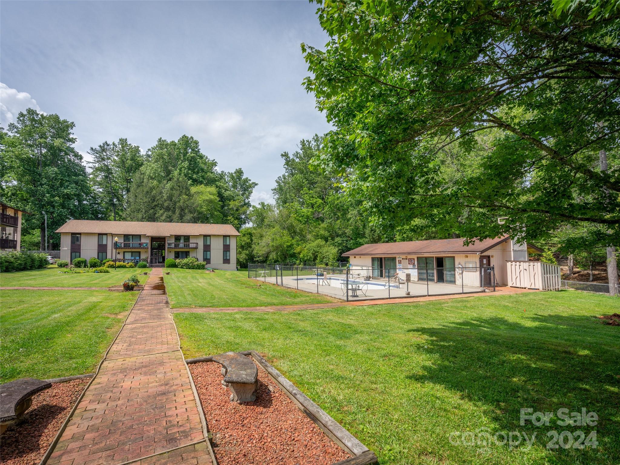 111 Shepard Square, Unit 608 Brevard, NC 28712 - Photo 26 of 29 a front view of a house with yard patio and green space