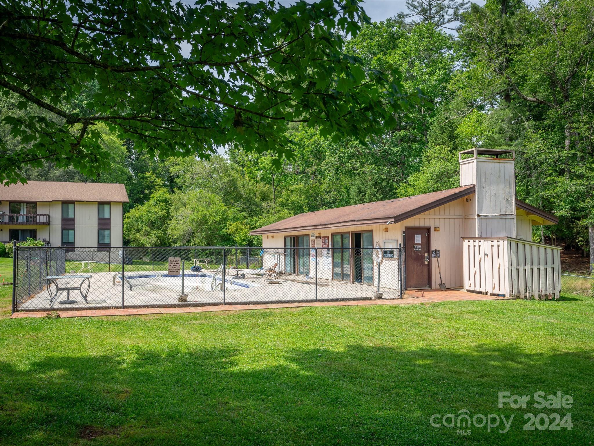 111 Shepard Square, Unit 608 Brevard, NC 28712 - Photo 27 of 29 a view of a house with a yard and a tree