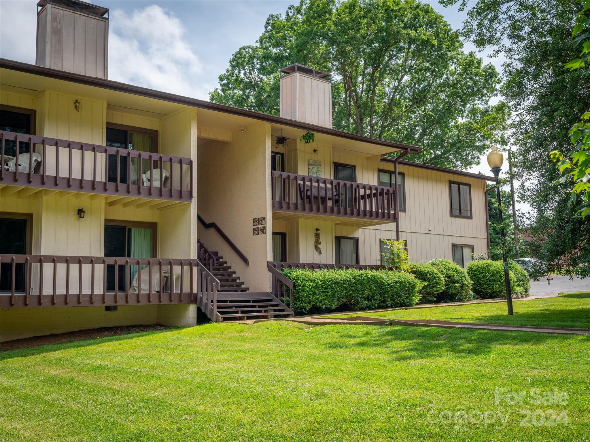 111 Shepard Square, Unit 608 Brevard, NC 28712 - Photo 28 of 29 a view of a house with a yard
