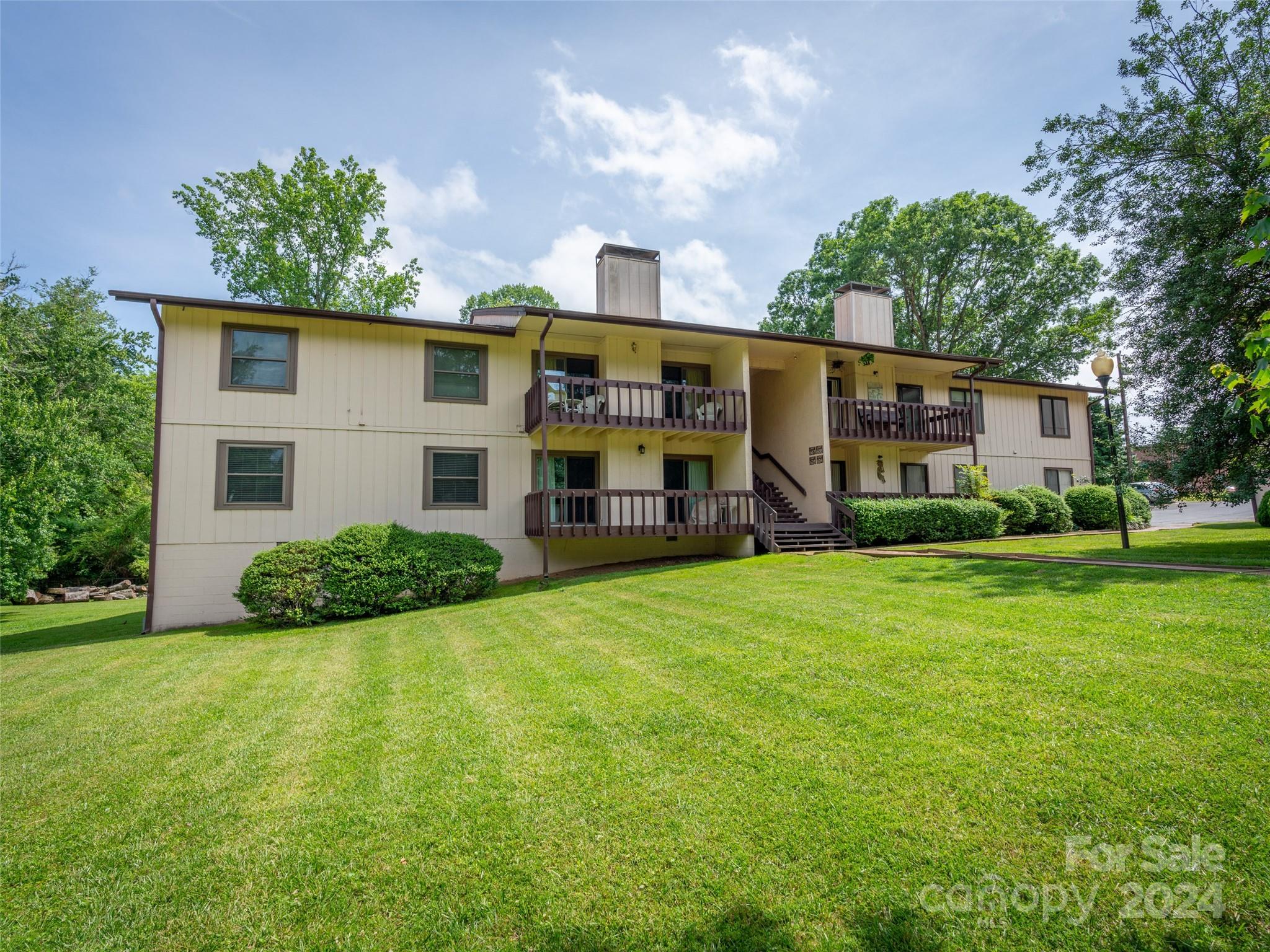 111 Shepard Square, Unit 608 Brevard, NC 28712 - Photo 29 of 29 a view of a house with backyard and garden