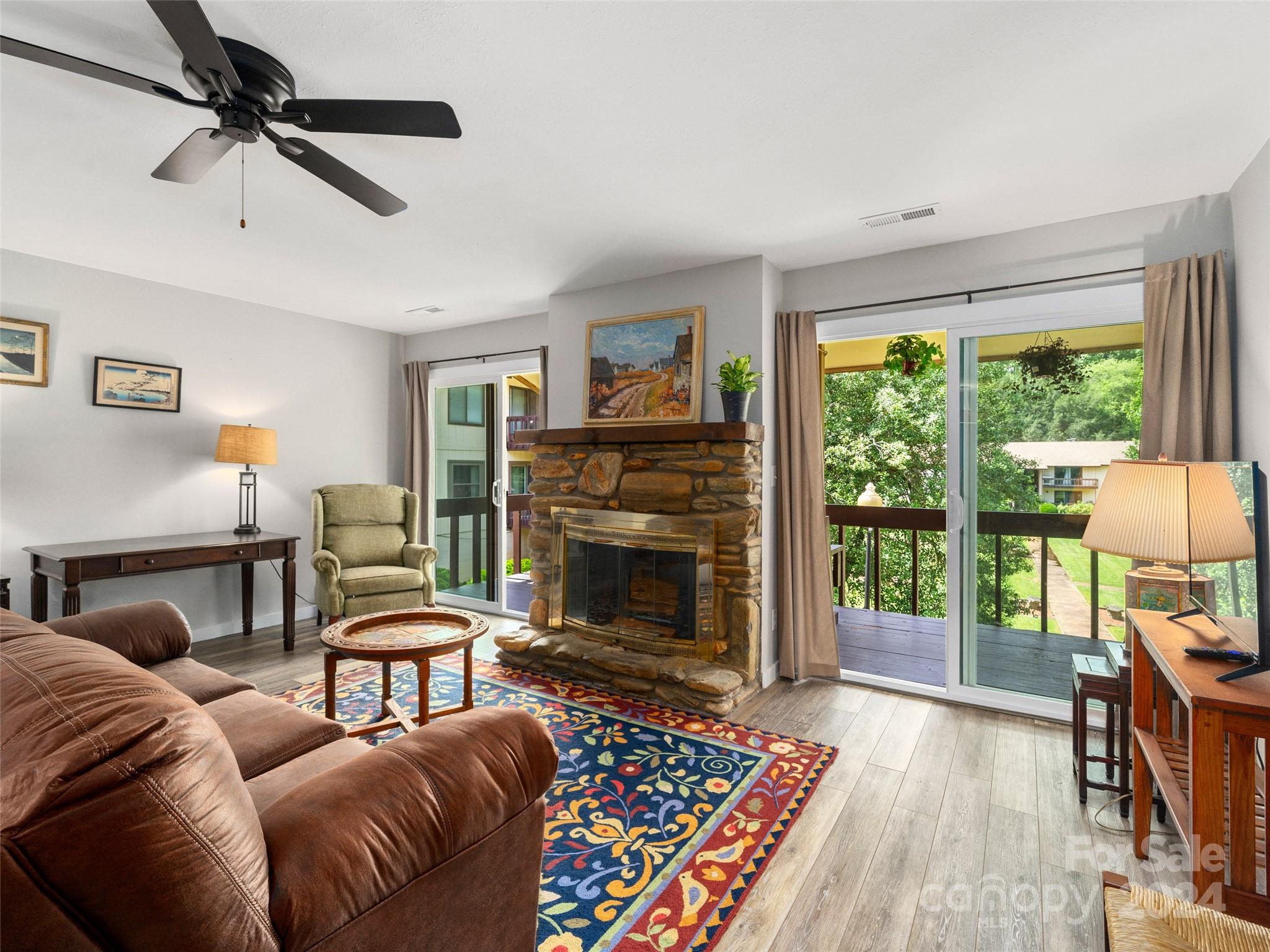 111 Shepard Square, Unit 608 Brevard, NC 28712 - Photo 3 of 29 a living room with furniture and a fireplace