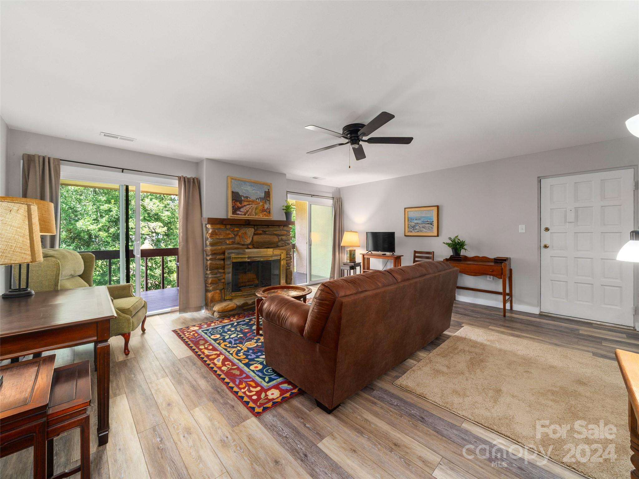 111 Shepard Square, Unit 608 Brevard, NC 28712 - Photo 4 of 29 a living room with furniture and a fireplace