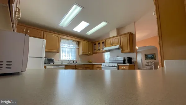 a view of a kitchen with furniture and a window