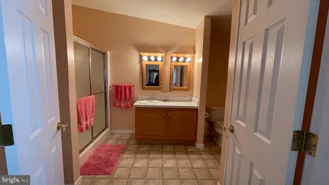 a bathroom with a mirror and a sink