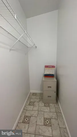 a bathroom with a sink toilet and window