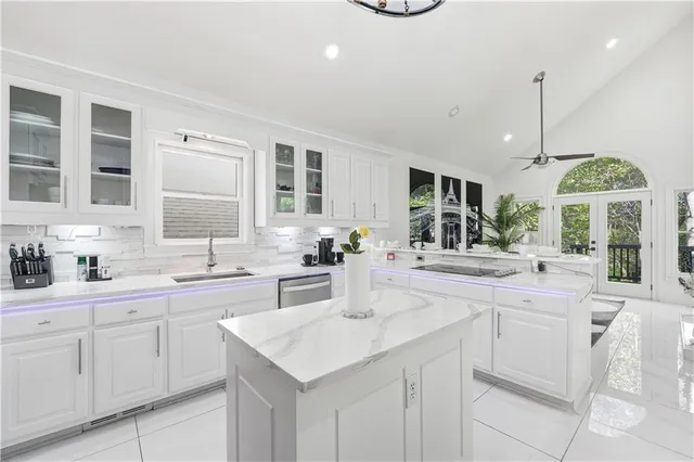 a view of a livingroom with furniture a fireplace and window