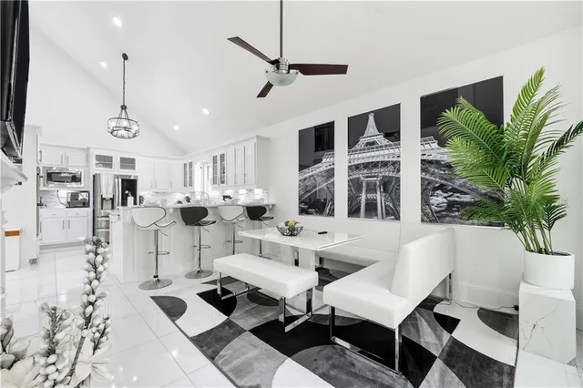 a view of living room with furniture and a fireplace