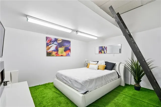 a bathroom with a sink vanity mirror and toilet