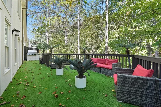 a view of a livingroom with furniture and staircase