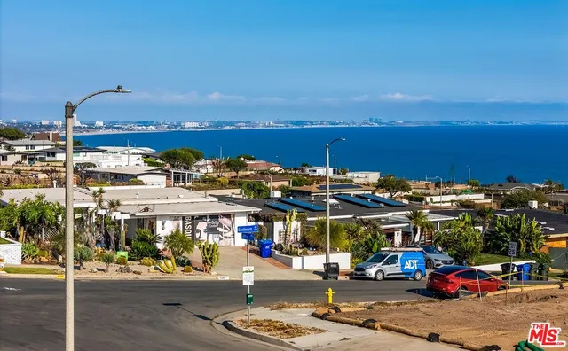 a view of an outdoor space with lounge chair