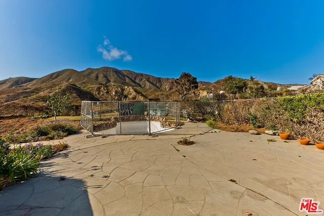 a view of a yard with an ocean view