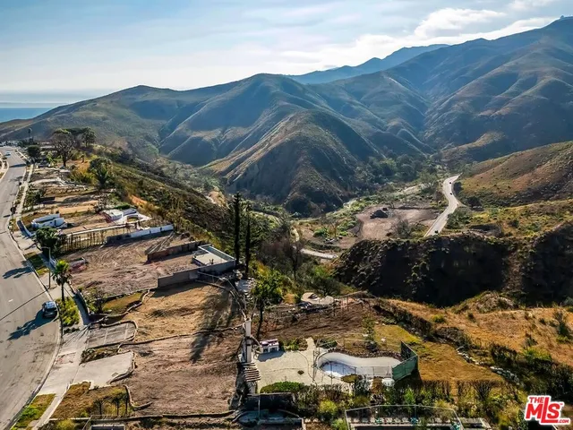 a view of a house with a mountain