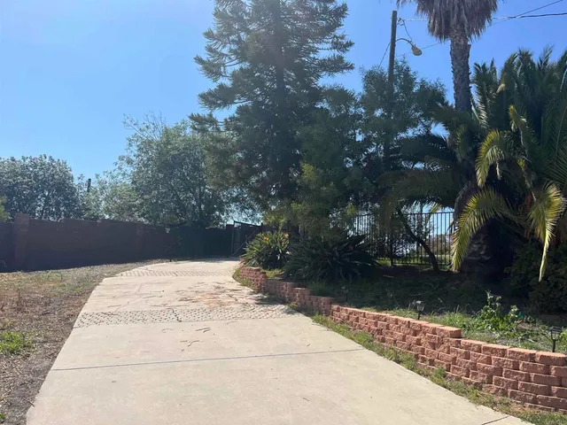 a view of backyard with green space