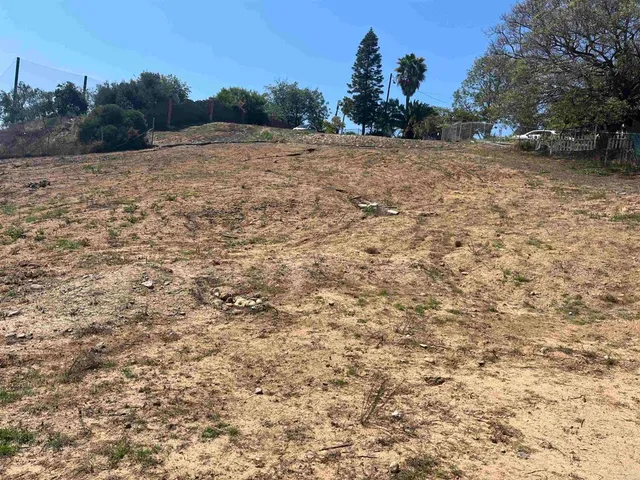 a view of a house with a street