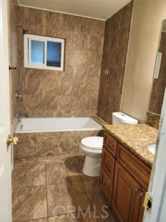 a bedroom with a bed and cabinets