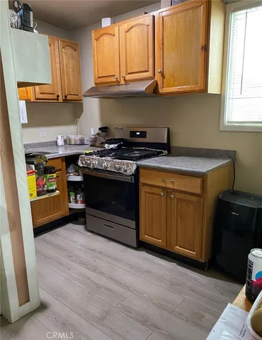 a kitchen with a stove and a sink
