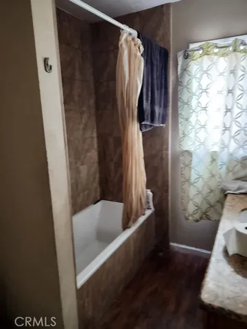 a bedroom with bed and a closet