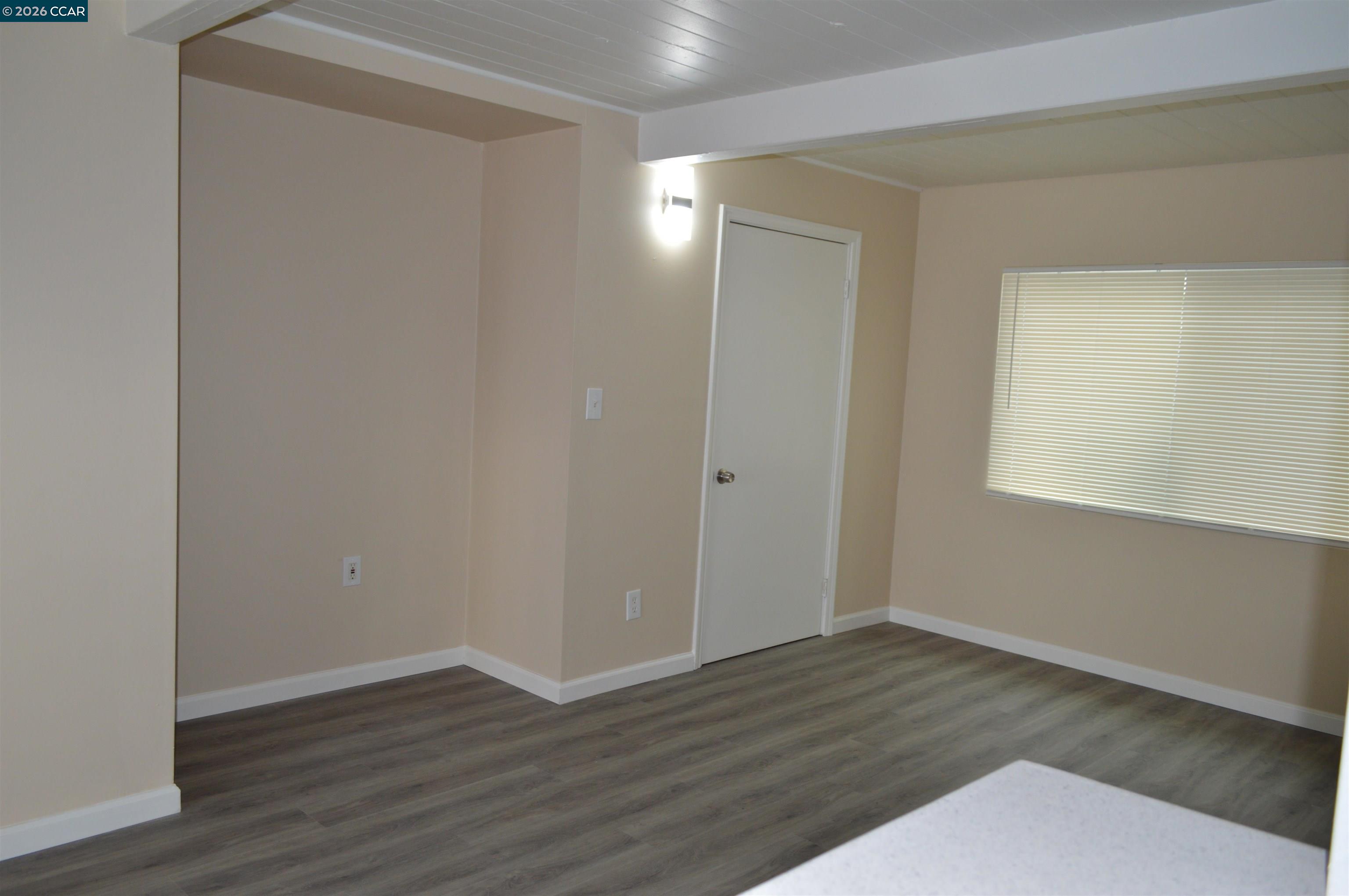 93 Beach Drive Bay Point, CA 94565 - Photo 5 of 9 a view of an empty room with wooden floor