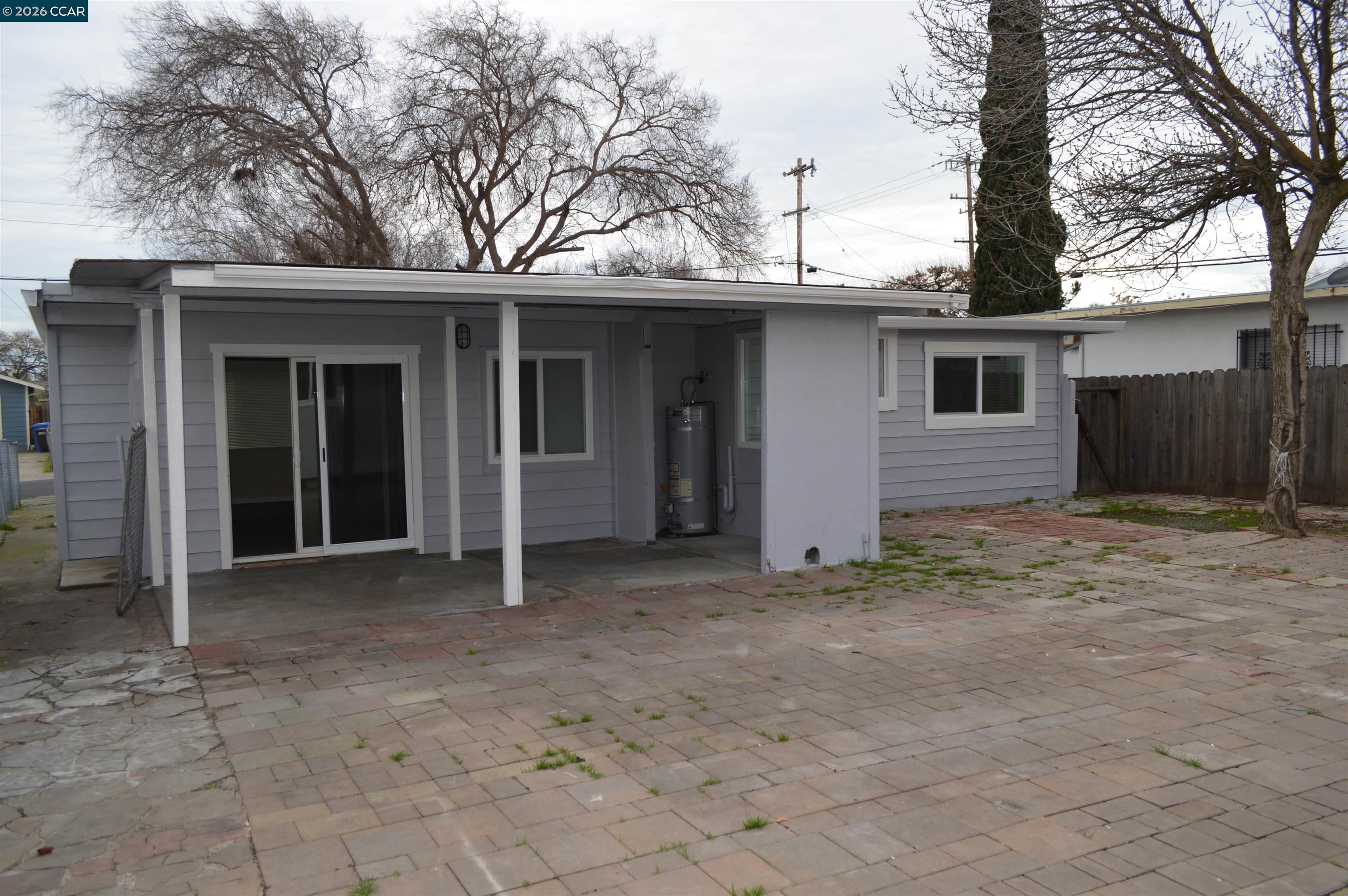 93 Beach Drive Bay Point, CA 94565 - Photo 6 of 9 a house with a tree in front of it