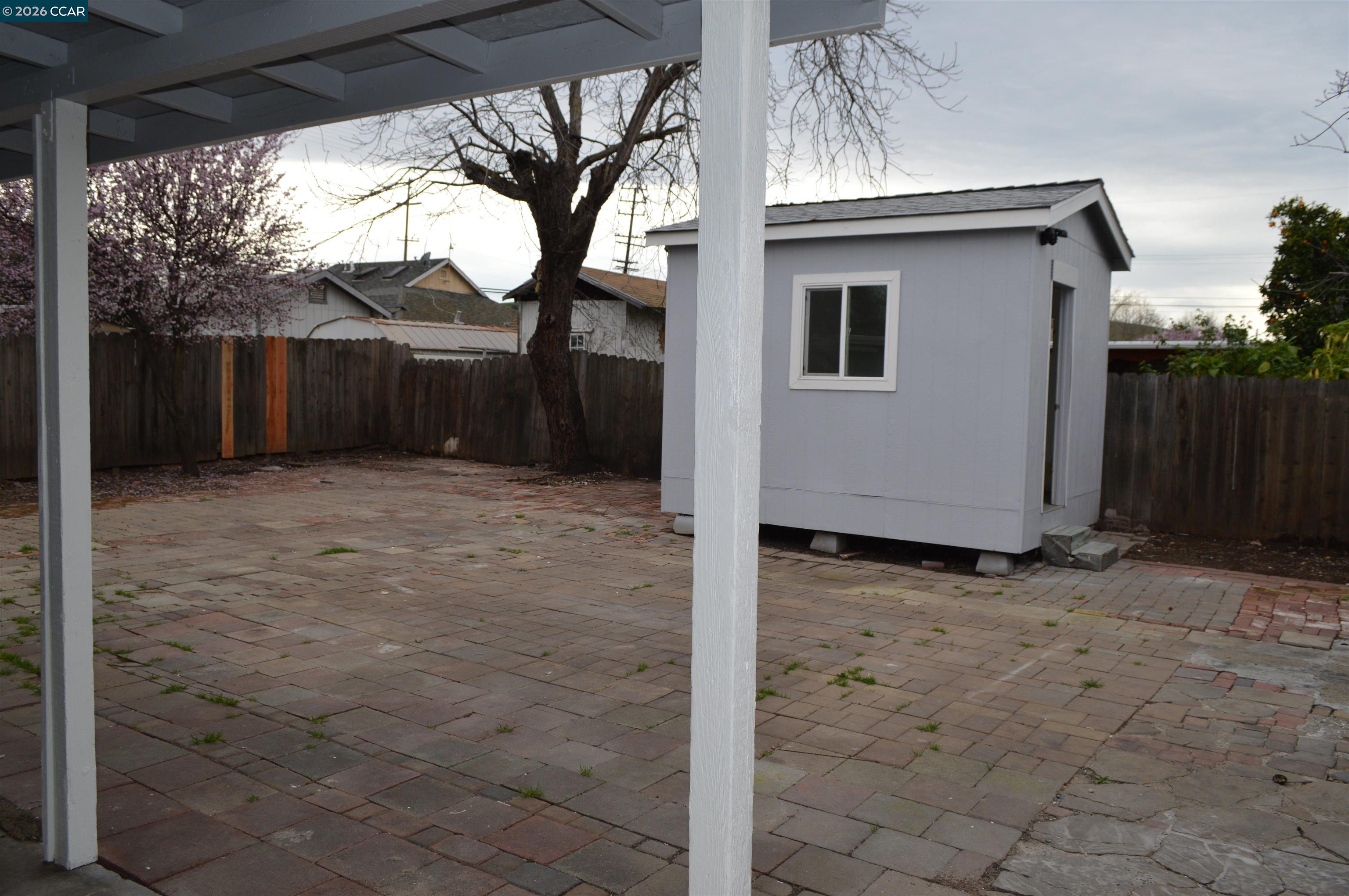 93 Beach Drive Bay Point, CA 94565 - Photo 8 of 9 a view of a house with a tree
