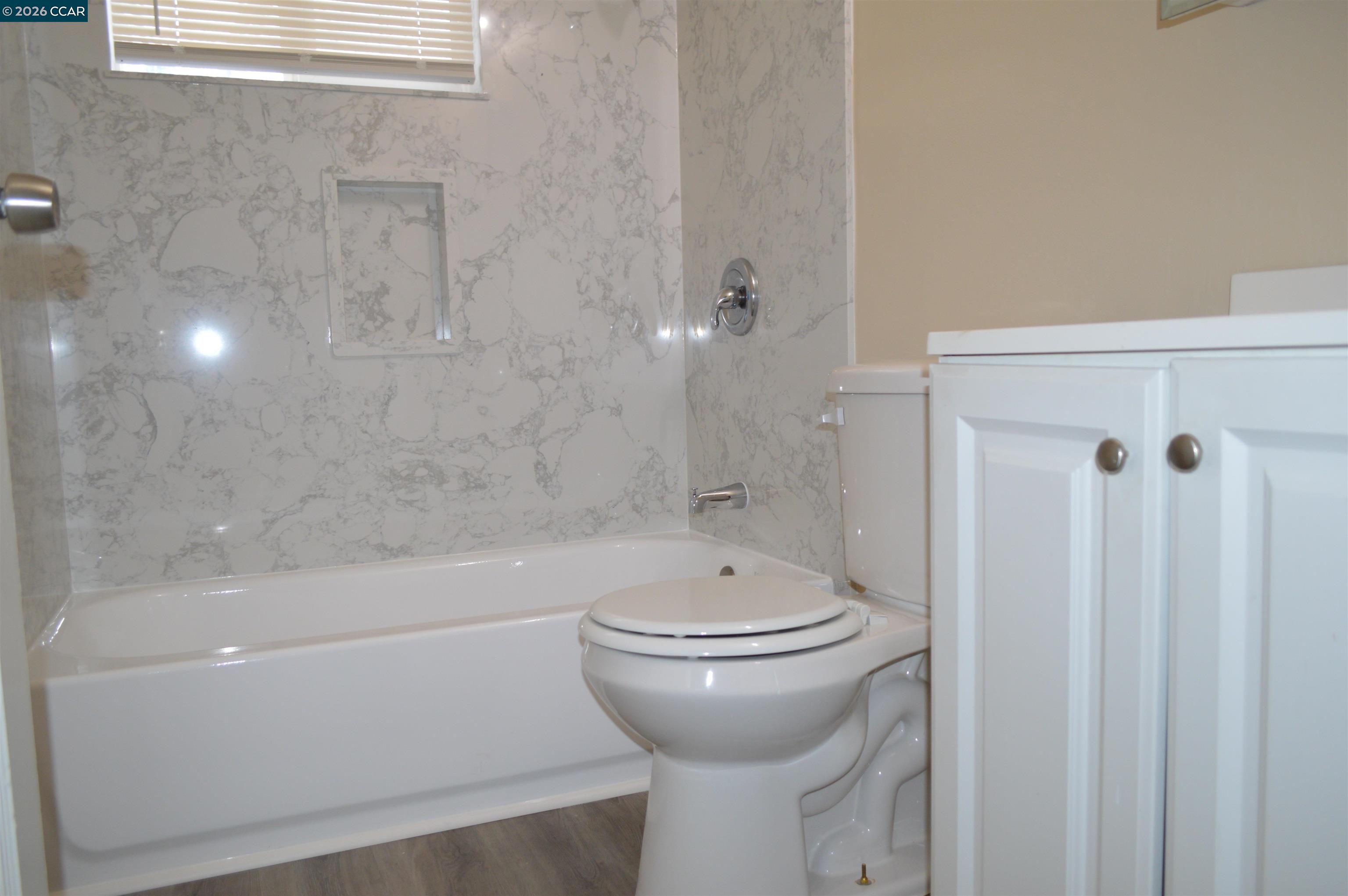 93 Beach Drive Bay Point, CA 94565 - Photo 9 of 9 a bathroom with a sink a toilet and shower