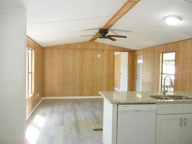 a bathroom with sinks a vanity and a large mirror
