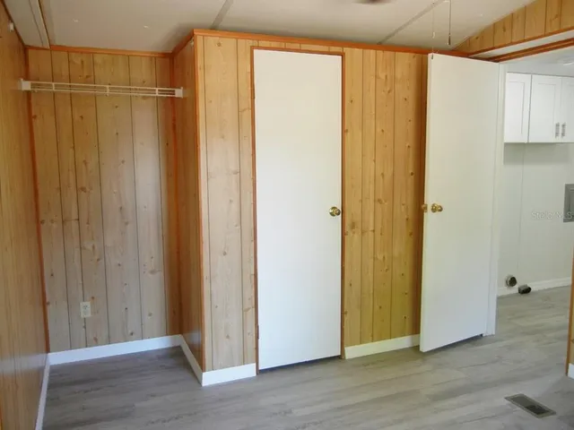 a view of a bathroom with wooden floor