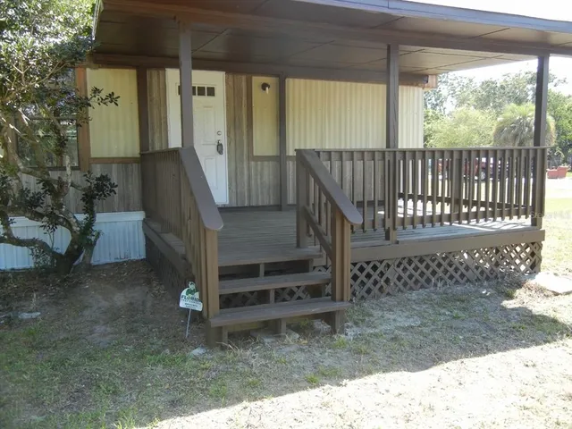 a view of a porch with a bench