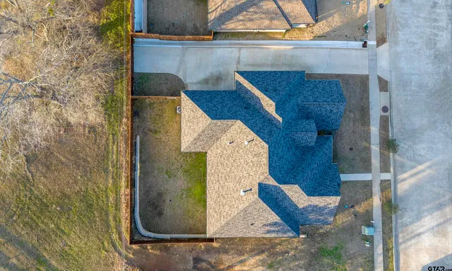 an aerial view of houses with outdoor space