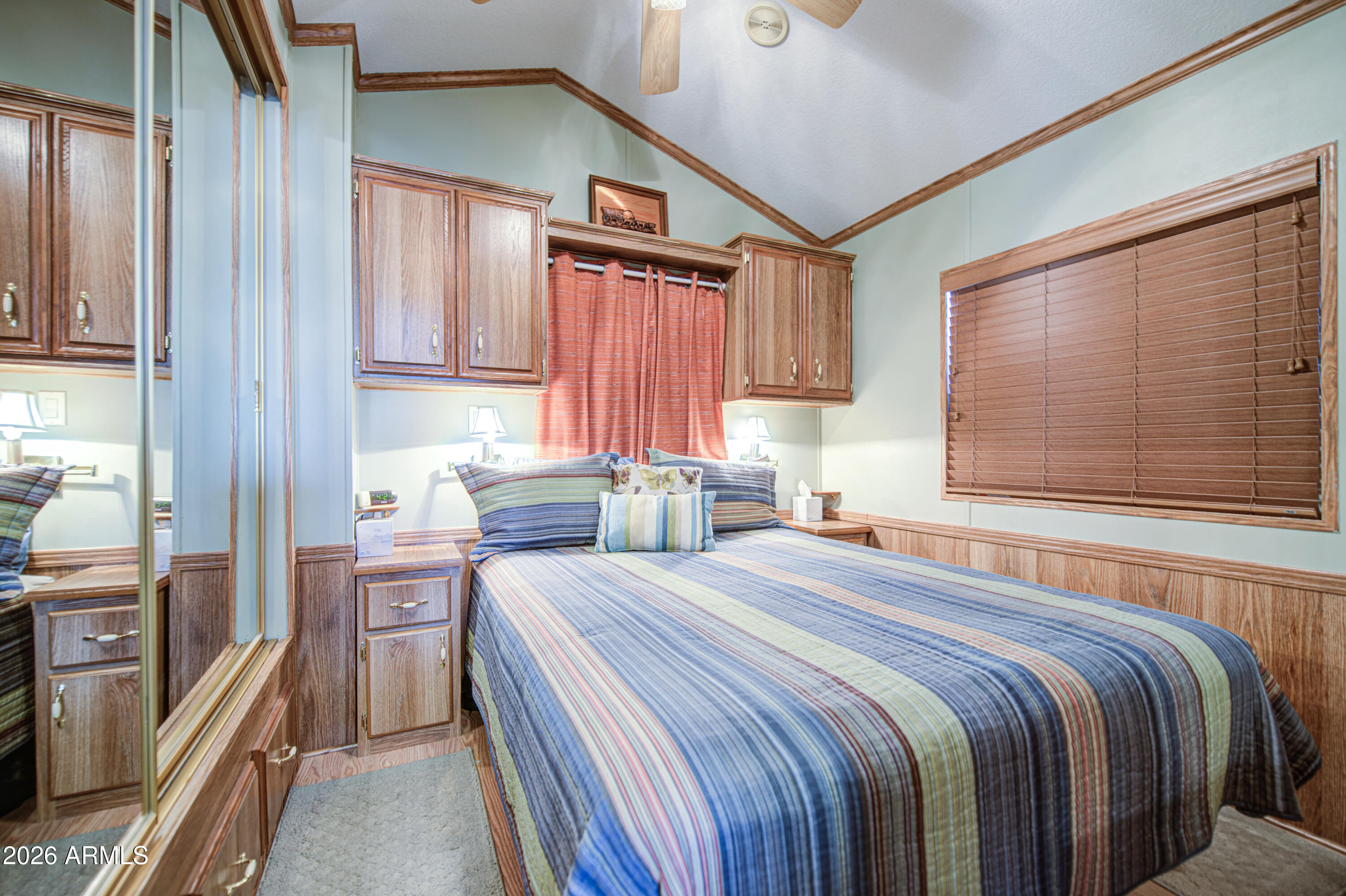 111 South Greenfield Road, Unit 765 Mesa, AZ 85206 - Photo 17 of 31 a bedroom with a bed and a dresser next to a window