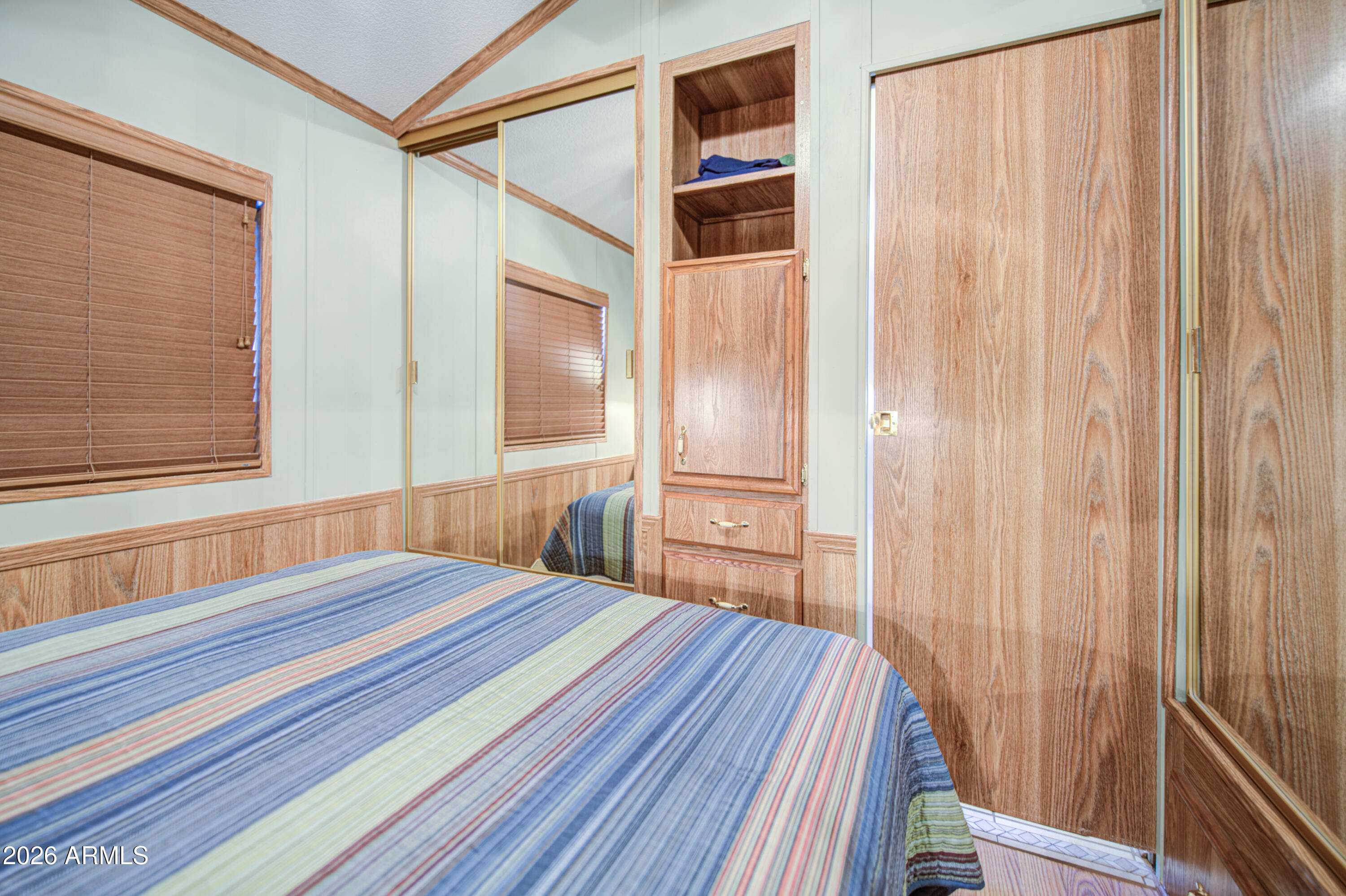 111 South Greenfield Road, Unit 765 Mesa, AZ 85206 - Photo 19 of 31 a bedroom with a bed and a large window