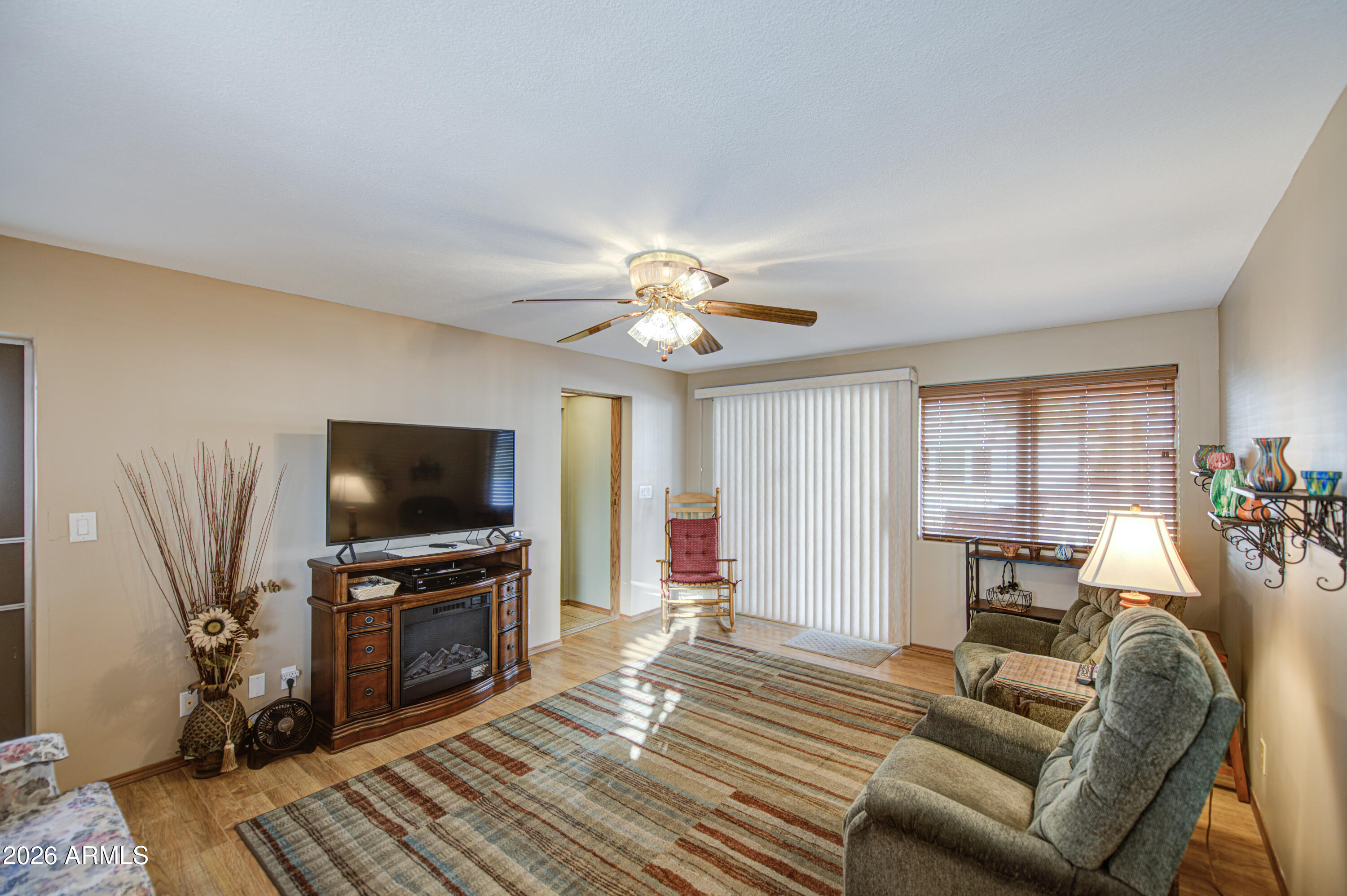 111 South Greenfield Road, Unit 765 Mesa, AZ 85206 - Photo 20 of 31 a living room with furniture and a flat screen tv