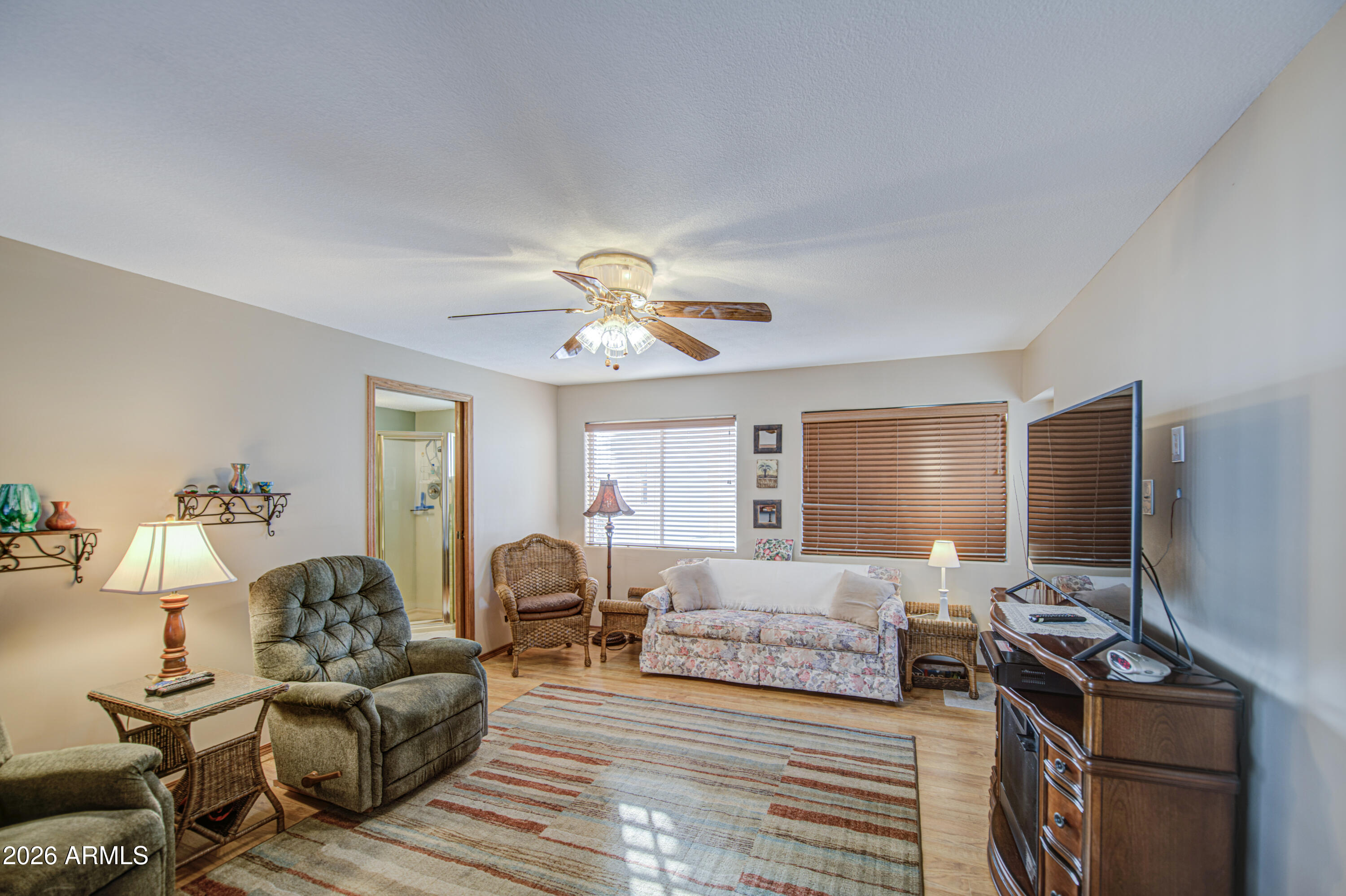 111 South Greenfield Road, Unit 765 Mesa, AZ 85206 - Photo 22 of 31 a living room with furniture and a flat screen tv
