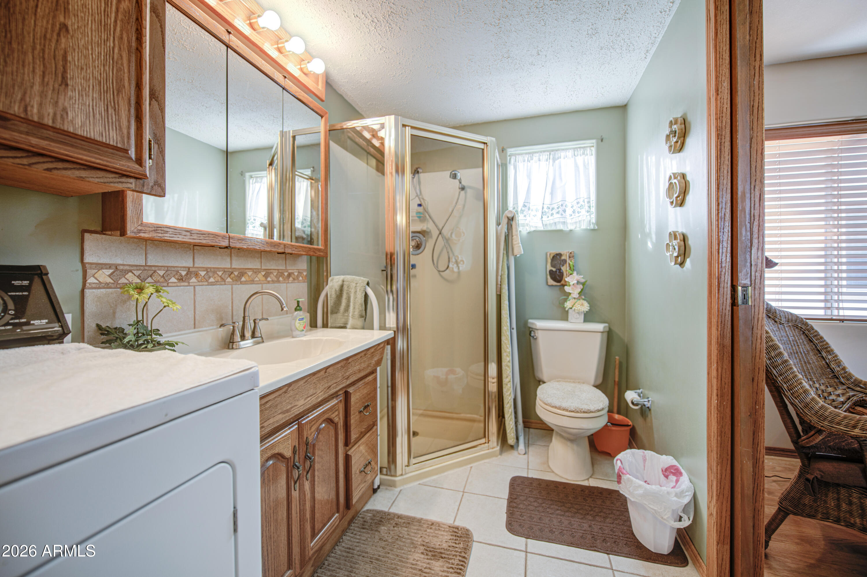 111 South Greenfield Road, Unit 765 Mesa, AZ 85206 - Photo 24 of 31 a bathroom with a sink toilet and shower