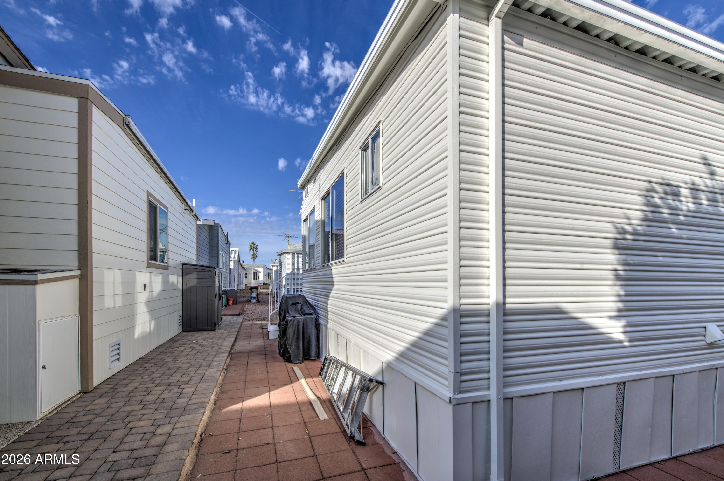 111 South Greenfield Road, Unit 765 Mesa, AZ 85206 - Photo 28 of 31 a view of a patio with a table and chairs