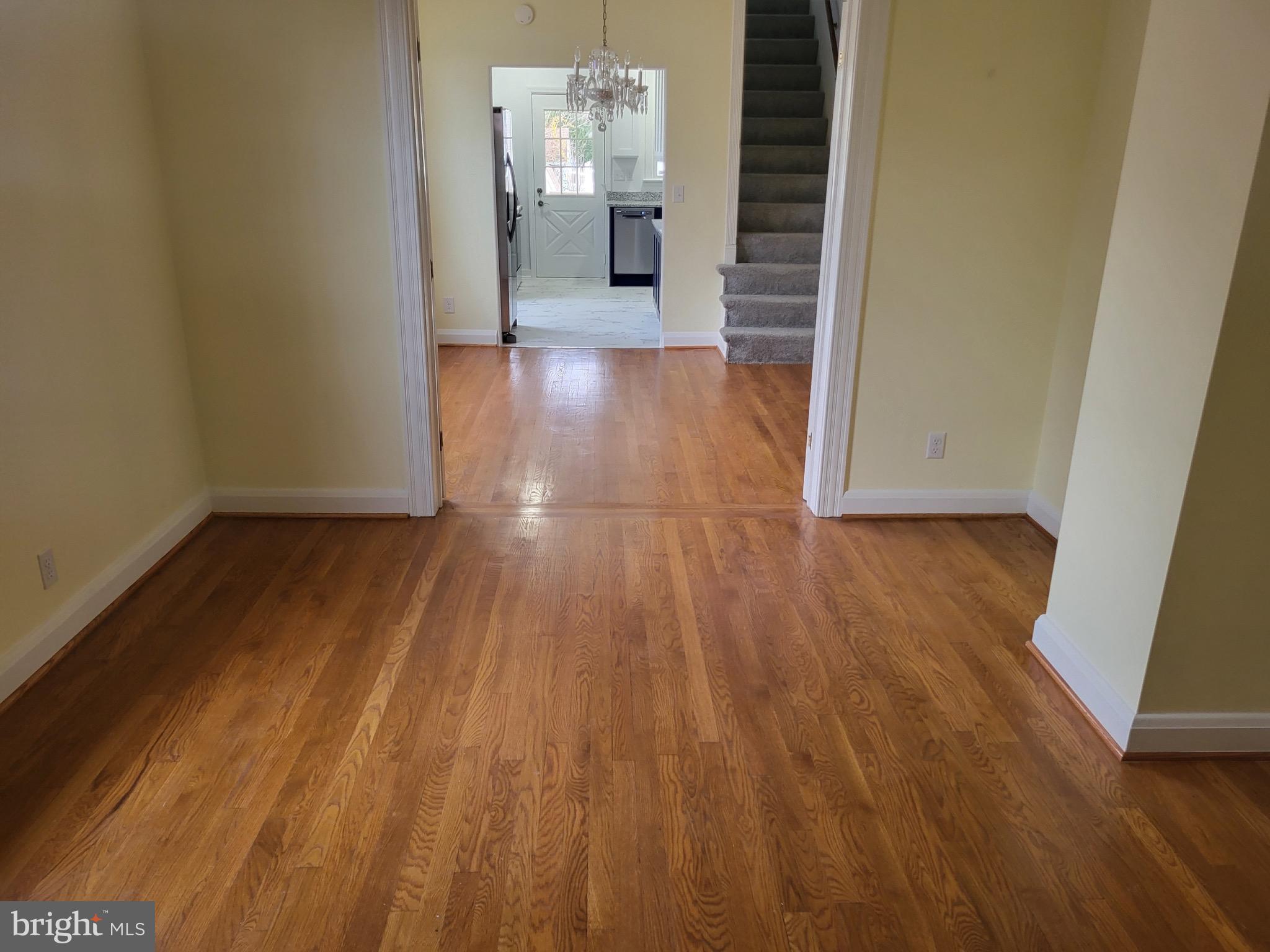 3108 Texas Avenue Baltimore, MD 21234 - Photo 14 of 34 a view of a hallway with wooden floor and stairs