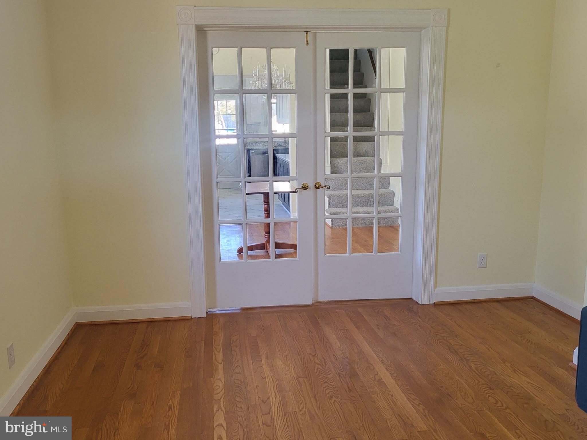 3108 Texas Avenue Baltimore, MD 21234 - Photo 15 of 34 an empty room with wooden floor and windows