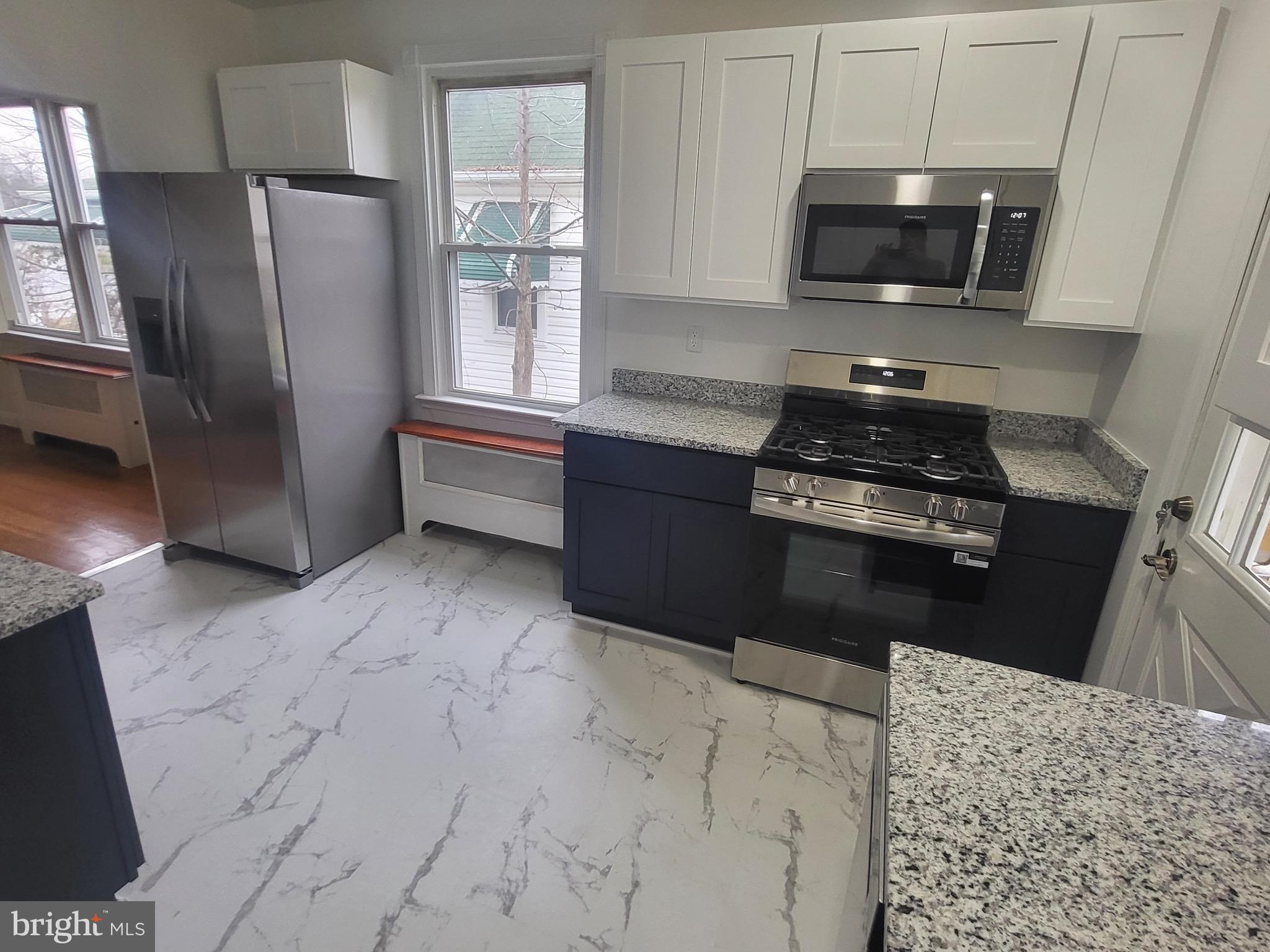 3108 Texas Avenue Baltimore, MD 21234 - Photo 18 of 34 a kitchen with a refrigerator stove and microwave