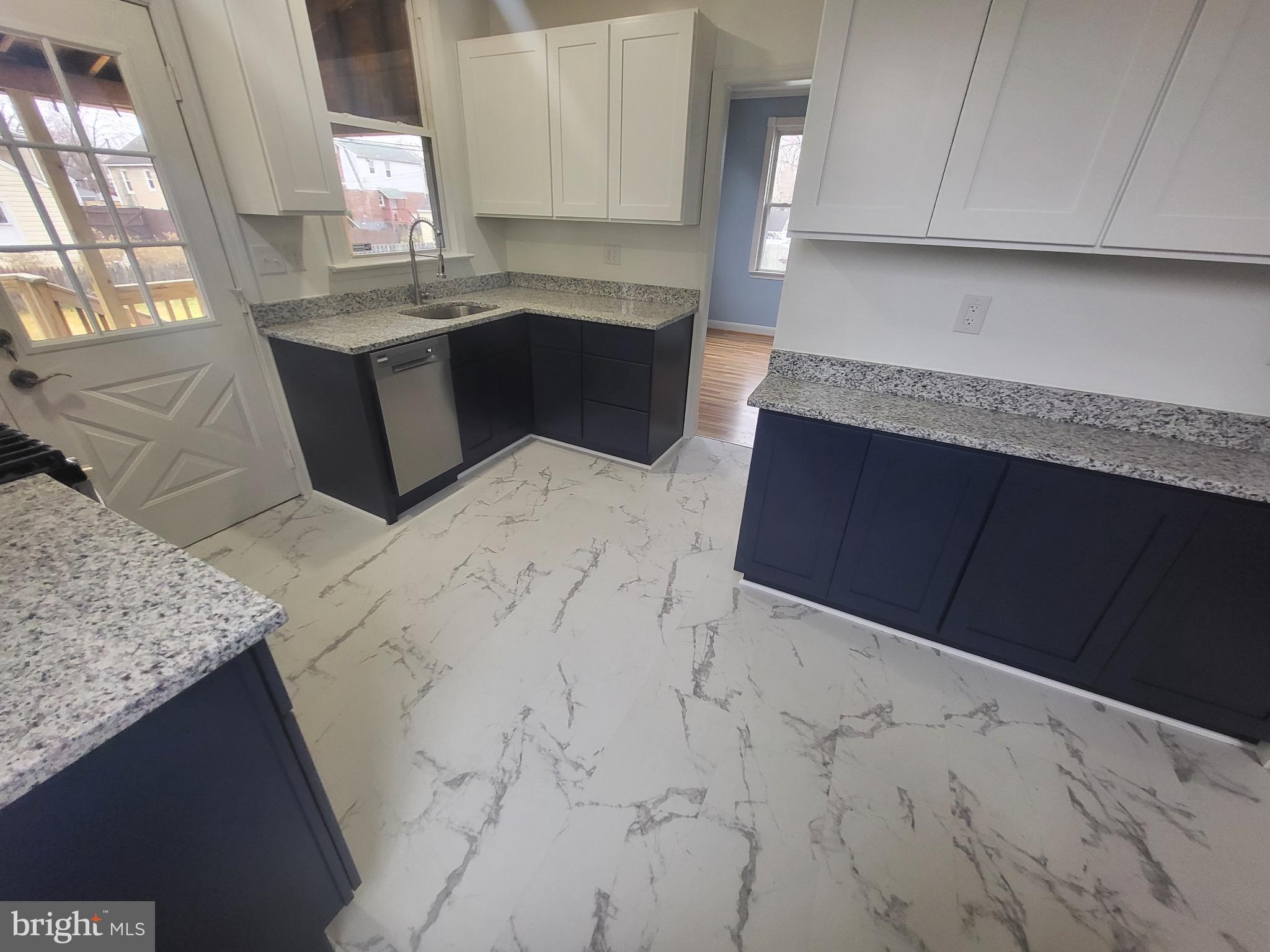 3108 Texas Avenue Baltimore, MD 21234 - Photo 19 of 34 a kitchen with granite countertop sink and cabinets