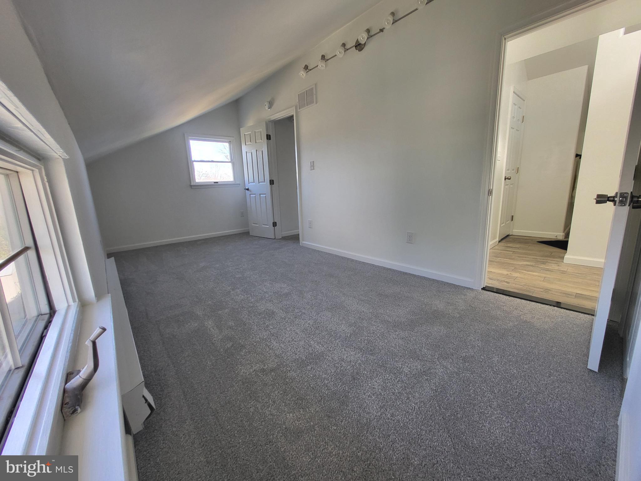 3108 Texas Avenue Baltimore, MD 21234 - Photo 21 of 34 a view of an empty room with a window
