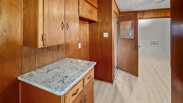 a view of kitchen island with sink