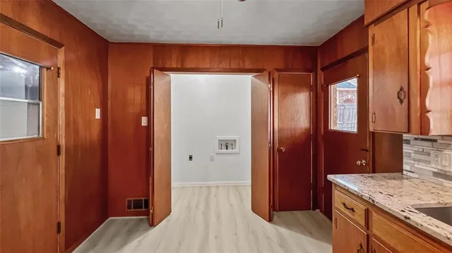 a bathroom with a granite countertop sink and shower