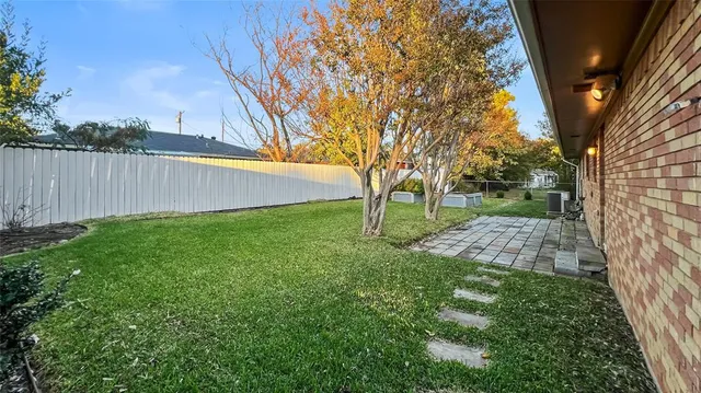 a view of backyard with tree