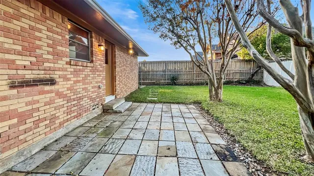 a view of a backyard of the house