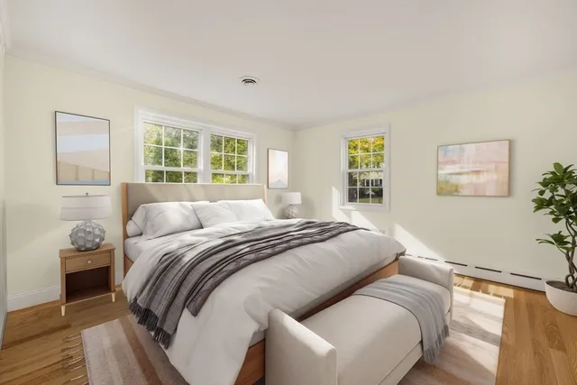 a bedroom with a large bed and a window