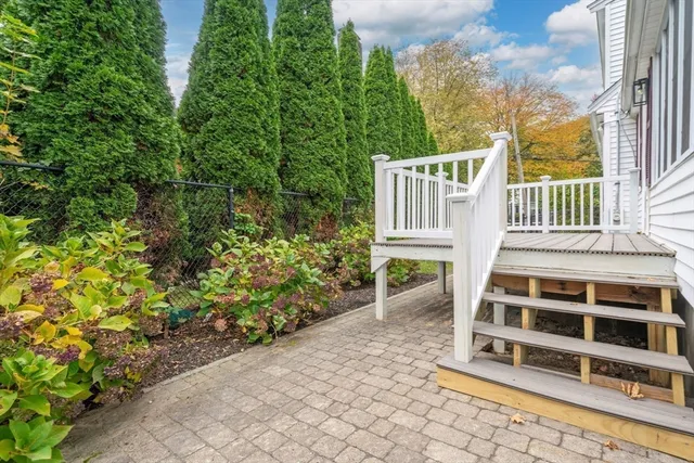 a view of a backyard with sitting area
